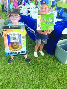 Liam Brown and Monroe Scott with Raffle Prizes 